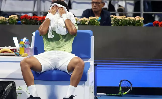 Arthur Fils of France reacts after smashing his racquet as he plays Spain's Carlos Alcaraz during the final of Qatar Open tennis in Doha, Qatar, Saturday Feb. 21, 2026. (AP Photo/Hussein Sayyed)