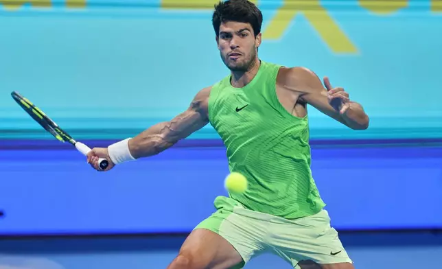 Spain's Carlos Alcaraz returns to Arthur Fils of France during the final of Qatar Open tennis in Doha, Qatar, Saturday Feb. 21, 2026. (AP Photo/Hussein Sayyed)