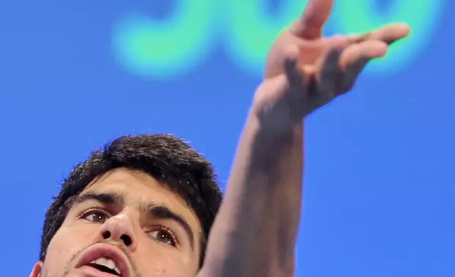 Spain's Carlos Alcaraz serves to Arthur Fils of France during the final of Qatar Open tennis in Doha, Qatar, Saturday Feb. 21, 2026. (AP Photo/Hussein Sayyed)