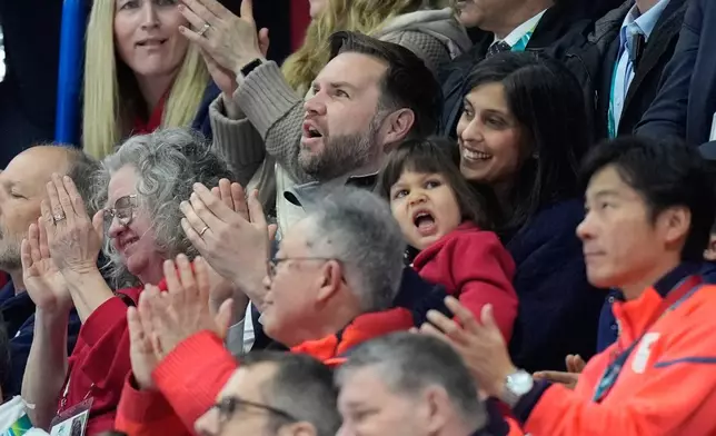 Vice President JD Vance, center, and his wife Usha Vance applaud while Madison Chock and Evan Bates of the United States compete during the figure skating ice dance team event at the 2026 Winter Olympics, in Milan, Italy, Friday, Feb. 6, 2026. (AP Photo/Francisco Seco)