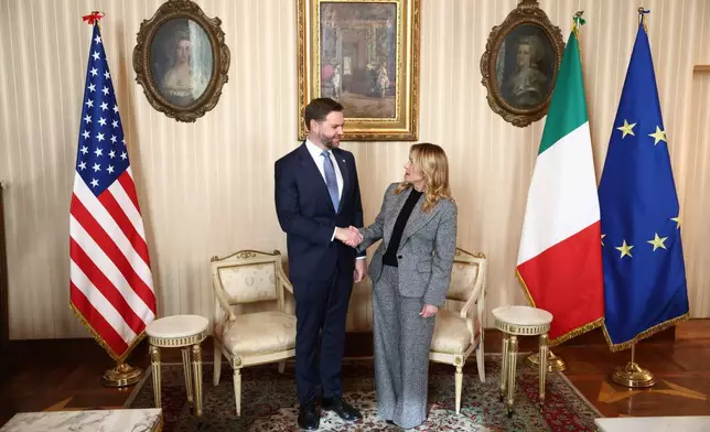 Italy's Prime Minister Giorgia Meloni, right, and US Vice President JD Vance hold a bilateral meeting during his visit to the 2026 Winter Olympics, in Milan, Italy, Friday, Feb. 6, 2026. (Kevin Lamarque/Pool Photo via AP)