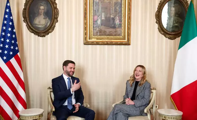 Italy's Prime Minister Giorgia Meloni, right, and US Vice President JD Vance hold a bilateral meeting during his visit to the 2026 Winter Olympics, in Milan, Italy, Friday, Feb. 6, 2026. (Kevin Lamarque/Pool Photo via AP)