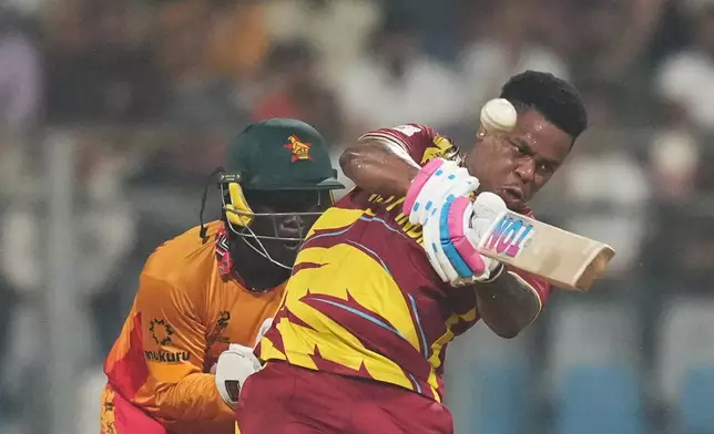West Indies' Shimron Hetmyer hits a six during the T20 World Cup cricket match between Zimbabwe and West Indies in Mumbai, India, Monday, Feb. 23, 2026. (AP Photo/Rafiq Maqbool)
