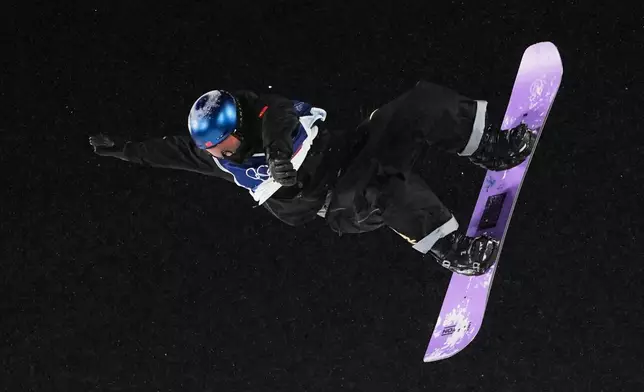 China's Su Yiming practices during a snowboard big air training session at the 2026 Winter Olympics, in Livigno, Italy, Wednesday, Feb. 4, 2026. (AP Photo/Lindsey Wasson)