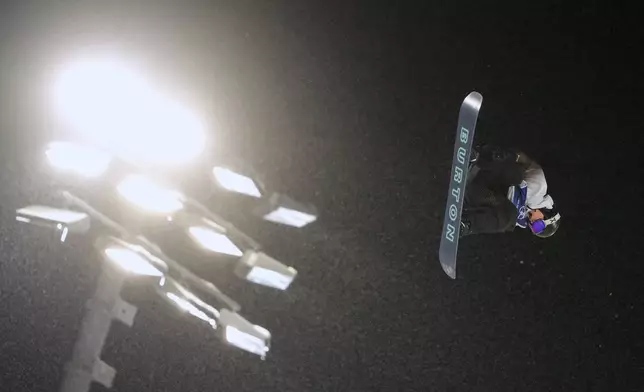 China's Yang Wenlong practices during a snowboard big air training session at the 2026 Winter Olympics, in Livigno, Italy, Wednesday, Feb. 4, 2026. (AP Photo/Lindsey Wasson)