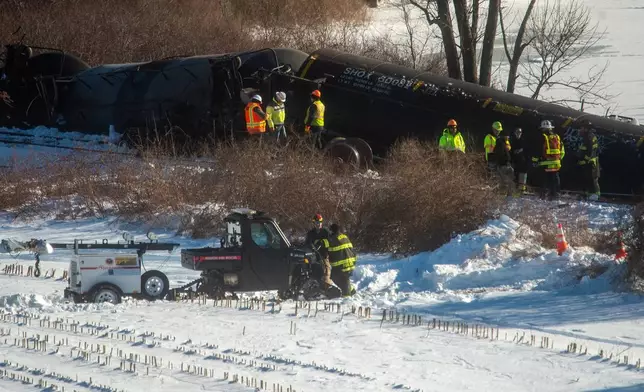 Crews inspect the scene after a freight train derailment, in Mansfield, Conn., Thursday, Feb. 5, 2026. (Aaron Flaum/Hartford Courant via AP)