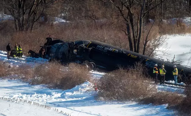 Crews inspect the scene after a freight train derailment, in Mansfield, Conn., Thursday, Feb. 5, 2026. (Aaron Flaum/Hartford Courant via AP)