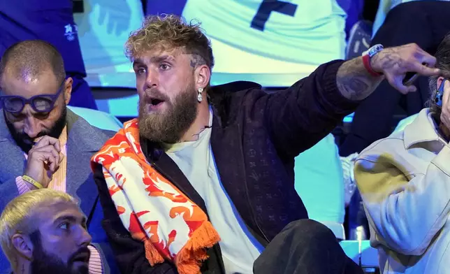 Jake Paul of the U.S., gestures as he waits to watch his fiancé Jutta Leerdam of the Netherlands compete in the women's 1,000 meters speedskating race at the 2026 Winter Olympics, in Milan, Italy, Monday, Feb. 9, 2026. (AP Photo/Antonio Calanni)