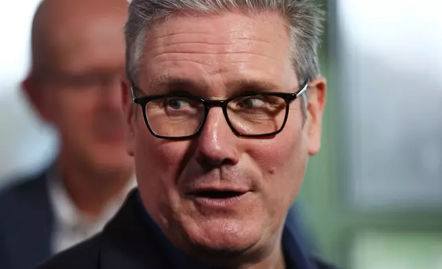 Britain's Prime Minister Keir Starmer talks with members of the audience after delivering a speech at Horntye Park Sports Complex in St Leonards-on-Sea, East Sussex, England, Thursday, Feb. 5, 2026. (Peter Nicholls/Pool Photo via AP)