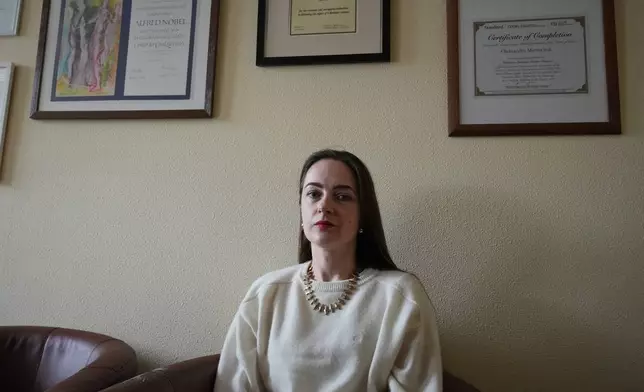 Oleksandra Matviichuk, head of the Center for Civil Liberties, poses in her office in Kyiv, Ukraine, Friday, Feb. 13, 2026. (AP Photo/Sergei Grits)