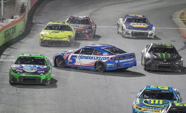 Kyle Busch (8) and Ty Gibbs (54) avoid Kyle Larson (5) spinning out during NASCAR's The Clash preseason auto race, Wednesday, Feb. 4, 2026, in Winston-Salem, N.C. (AP Photo/Matt Kelley)