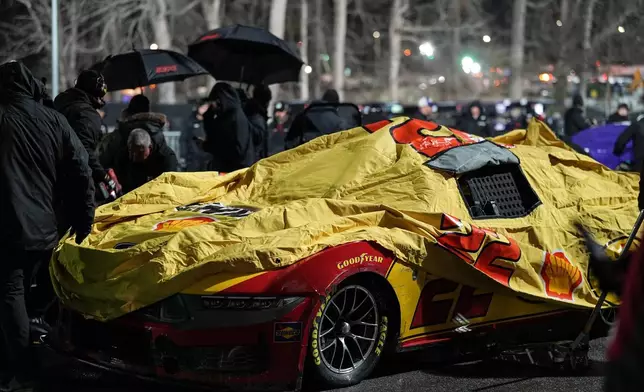 Joey Logano sits on pit road in a weather delay during NASCAR's The Clash preseason auto race, Wednesday, Feb. 4, 2026, in Winston-Salem, N.C. (AP Photo/Matt Kelley)