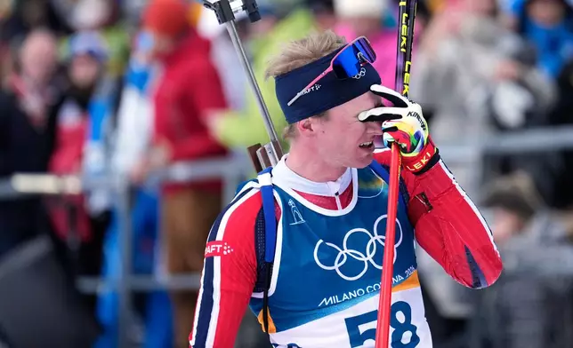 Johan-Olav Botn, of Norway, reacts after competing in the men's 20-kilometer individual biathlon race at the 2026 Winter Olympics in Anterselva, Italy, Tuesday, Feb. 10, 2026. (AP Photo/Mosa'ab Elshamy)