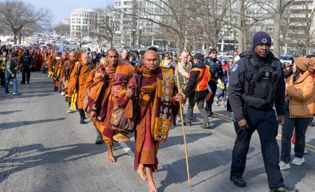 Bhikkhu Pannakara, center, leads his fellow Buddhist monks on Capitol Hill, during the Walk for Peace, in Washington, Wednesday, Feb., 11, 2026. (AP Photo/Rod Lamkey, Jr.)