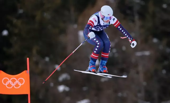 United States' Jacqueline Wiles speeds down the course during an alpine ski, women's downhill official training, at the 2026 Winter Olympics, in Cortina d'Ampezzo, Italy, Friday, Feb. 6, 2026. (AP Photo/Marco Trovati)
