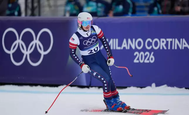United States' Jacqueline Wiles at the finish area during an alpine ski, women's downhill official training, at the 2026 Winter Olympics, in Cortina d'Ampezzo, Italy, Friday, Feb. 6, 2026. (AP Photo/Giovanni Auletta)