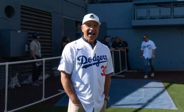 Los Angeles Dodgers manager Dave Roberts chats with reporters during DodgerFest at Dodger Stadium in Los Angeles, Saturday, Jan. 31, 2026. (AP Photo/Jae C. Hong)