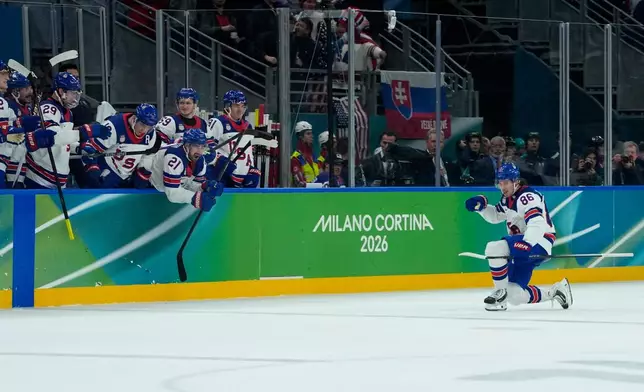 United States' Jack Hughes (86) celebrates after scoring his side's third goal during a men's ice hockey semifinal game between United States and Slovakia at the 2026 Winter Olympics, in Milan, Italy, Friday, Feb. 20, 2026. (AP Photo/Petr David Josek)