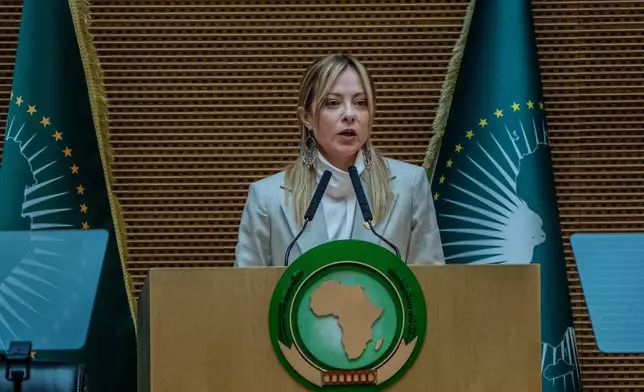 Italian Prime Minister Giorgia Meloni addresses the second Italy-Africa Summit at the Addis International Convention Center in Addis Ababa, Ethiopia, Saturday, Feb. 14, 2026. (AP Photo/Amanuel Sileshi)