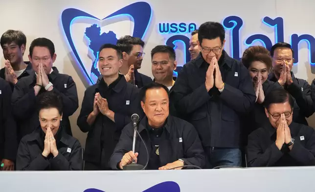 Thailand's Prime Minister and leader of Bhumjaithai Party Anutin Charnvirakul, center, speaks during a press conference at the party headquarters following the general election in Bangkok, Sunday, Feb. 8, 2026. (AP Photo/Sakchai Lalit)