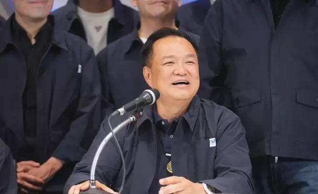 Thailand's Prime Minister and leader of Bhumjaithai Party Anutin Charnvirakul, center, speaks during a press conference at the party headquarters following the general election in Bangkok, Sunday, Feb. 8, 2026. (AP Photo/Sakchai Lalit)