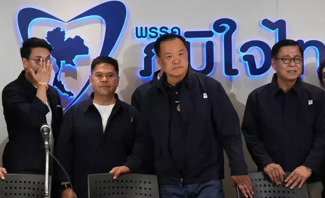 Thailand's Prime Minister and leader of Bhumjaithai Party Anutin Charnvirakul, center, speaks during a press conference at the party headquarters following the general election in Bangkok, Sunday, Feb. 8, 2026. (AP Photo/Sakchai Lalit)