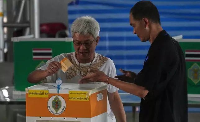 CORRECTS DATE TO 8, NOT 7 - A voter casts his ballot at a polling station during general election in Bangkok, Sunday, Feb. 8, 2026. (AP Photo/Sakchai Lalit)