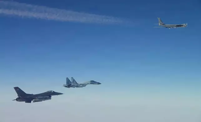 This photo provided by the U.S. Department of Defense shows a North American Aerospace Defense Command F-16 fighter aircraft intercepting Russian Tu-95 and Su-35 military aircraft near the Bering Strait, west of Alaska, on Thursday, Feb. 19, 2026. (Department of Defense photo via AP)