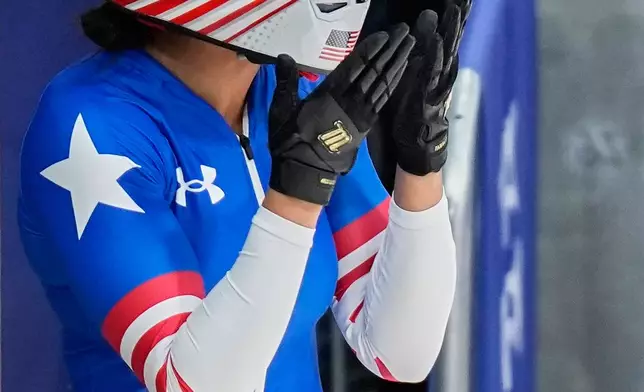 United States' Kaysha Love arrives at the finish during a women's monobob run at the 2026 Winter Olympics, in Cortina d'Ampezzo, Italy, Monday, Feb. 16, 2026. (AP Photo/Aijaz Rahi)