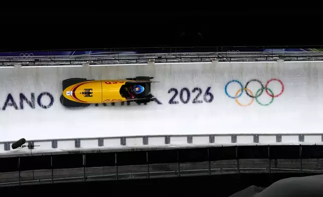 Germany's Laura Nolte slides down the track during a women's monobob run at the 2026 Winter Olympics, in Cortina d'Ampezzo, Italy, Monday, Feb. 16, 2026. (AP Photo/Alessandra Tarantino)