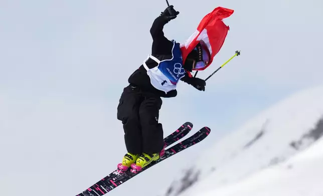Switzerland's Mathilde Gremaud celebrates her gold medal on her final run in the women's freestyle skiing slopestyle finals at the 2026 Winter Olympics, in Livigno, Italy, Monday, Feb. 9, 2026. (AP Photo/Abbie Parr)