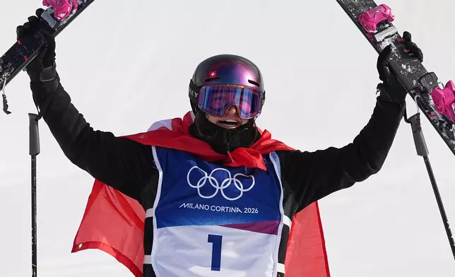 Switzerland's Mathilde Gremaud celebrates her gold medal win in the women's freestyle skiing slopestyle finals at the 2026 Winter Olympics, in Livigno, Italy, Monday, Feb. 9, 2026. (AP Photo/Gregory Bull)