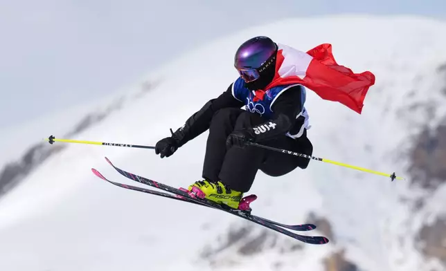 Switzerland's Mathilde Gremaud celebrates her gold medal on her final run in the women's freestyle skiing slopestyle finals at the 2026 Winter Olympics, in Livigno, Italy, Monday, Feb. 9, 2026. (AP Photo/Abbie Parr)