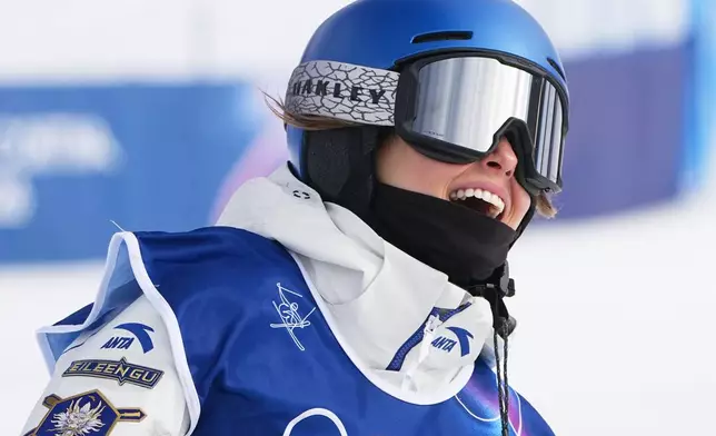 China's Eileen Gu celebrates during the women's freestyle skiing slopestyle finals at the 2026 Winter Olympics, in Livigno, Italy, Monday, Feb. 9, 2026. (AP Photo/Gregory Bull)