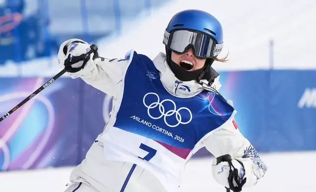 China's Eileen Gu celebrates during the women's freestyle skiing slopestyle finals at the 2026 Winter Olympics, in Livigno, Italy, Monday, Feb. 9, 2026. (AP Photo/Gregory Bull)