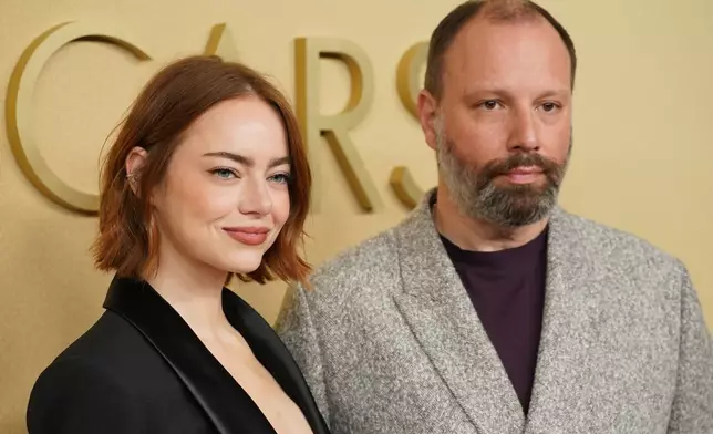 Emma Stone, left, and Yorgos Lanthimos arrive at the 98th Academy Awards Oscar nominees luncheon on Tuesday, Feb. 10, 2026, at the Beverly Hilton Hotel in Beverly Hills, Calif. (Photo by Jordan Strauss/Invision/AP)