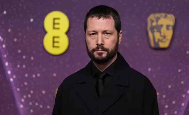 Mstyslav Chernov poses for photographers upon arrival at the 79th British Academy Film Awards, BAFTA's, in London, Sunday, Feb. 22, 2026. (AP Photo/Alastair Grant)