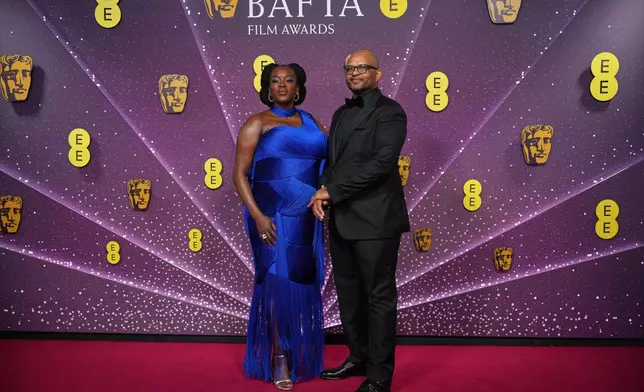Wunmi Mosaku, left and Tash Moseley pose for photographers upon arrival at the 79th British Academy Film Awards, BAFTA's, in London, Sunday, Feb. 22, 2026. (AP Photo/Alastair Grant)