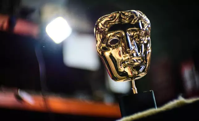 A completed British Academy Film Awards mask sits on a workbench at the FSE Foundry in Braintree, England on Tuesday, Feb. 10, 2026. (Scott A Garfitt/Invision/AP)
