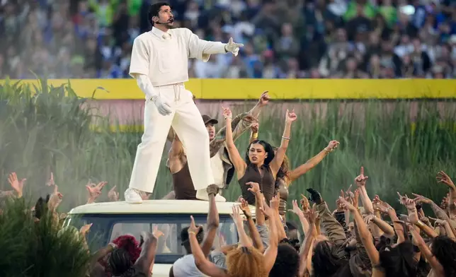 Bad Bunny performs during halftime of the NFL Super Bowl 60 football game between the New England Patriots and the Seattle Seahawks, Sunday, Feb. 8, 2026, in Santa Clara, Calif. (AP Photo/Julio Cortez)