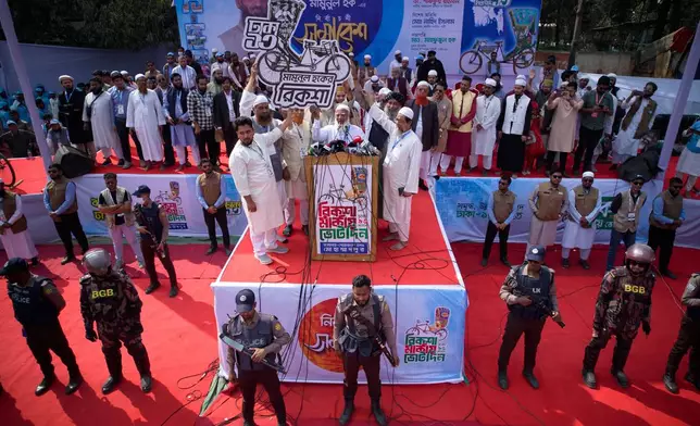 Jamaat-e-Islami leader Shafiqur Rahman, centre, and other leaders hold their election symbol during the last day of an election rally for Bangladesh Khilafat Majlis candidate Mamunul Haque, organized by the eleven party alliance in Dhaka, Bangladesh, Monday, Feb. 9, 2026. (AP Photo/Anupam Nath)