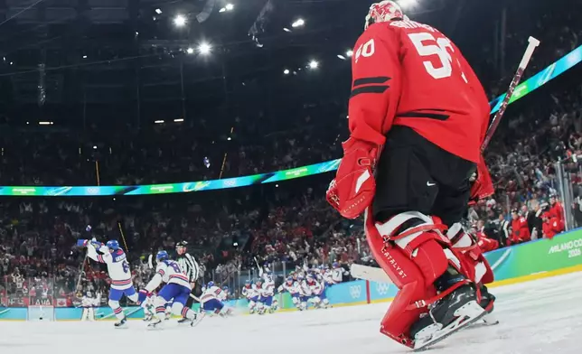 Canada's Jordan Binnington (50) reacts after United States' Jack Hughes, not seen, scored his side's second goal during a men's ice hockey gold medal game between Canada and the United States at the 2026 Winter Olympics, in Milan, Italy, Sunday, Feb. 22, 2026. (Bruce Bennett/Pool Photo via AP)