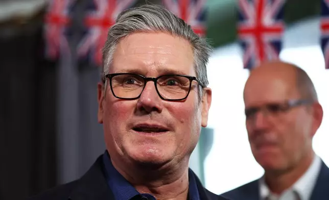 Britain's Prime Minister Keir Starmer talks with members of the audience after delivering a speech at Horntye Park Sports Complex in St Leonards-on-Sea, East Sussex, England, Thursday, Feb. 5, 2026. (Peter Nicholls/Pool Photo via AP)