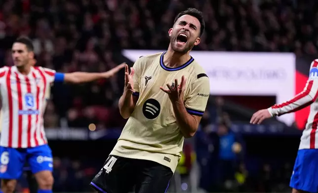 Barcelona's Eric Garcia reacts during the Copa del Rey semifinal first leg soccer match between Atletico Madrid and Barcelona in Madrid, Spain, Thursday, Feb. 12, 2026. (AP Photo/Manu Fernandez)