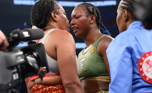 Claressa Shields, right, exchanges words with Franchon Crews-Dezurn after their Undisputed Heavyweight World Championship boxing match, Sunday, Feb. 22, 2026, in Detroit. (AP Photo/Lon Horwedel)