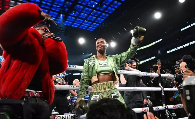 Claressa Shields enters the arena for her Undisputed Heavyweight World Championship boxing match against Franchon Cruz-Dezurn, Sunday, Feb. 22, 2026, in Detroit. (AP Photo/Lon Horwedel)