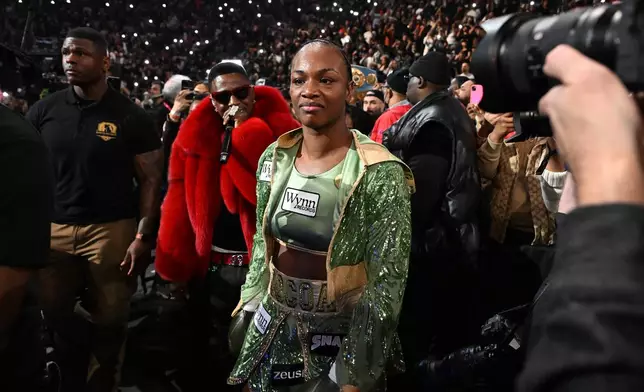 Claressa Shields enters the arena for her Undisputed Heavyweight World Championship boxing match against Franchon Crews-Dezurn, Sunday, Feb. 22, 2026, in Detroit. (AP Photo/Lon Horwedel)