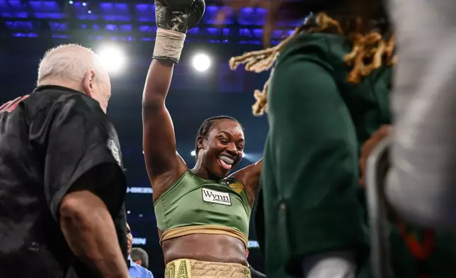 Claressa Shields celebrates her win over Franchon Crews-Dezurn in their Undisputed Heavyweight World Championship boxing match, Sunday, Feb. 22, 2026, in Detroit. (AP Photo/Lon Horwedel)