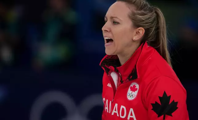 Canada's Rachel Homan in action during a women's curling semifinal match against Sweden, at the 2026 Winter Olympics, in Cortina d'Ampezzo, Italy, Friday, Feb. 20, 2026. (AP Photo/Misper Apawu)