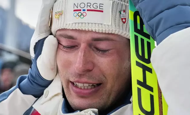 Sturla Holm Laegreid, of Norway, reacts after he won bronze in the men's 20-kilometer individual biathlon race at the 2026 Winter Olympics in Anterselva, Italy, Tuesday, Feb. 10, 2026. (AP Photo/Andrew Medichini)